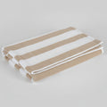 Striped towel with brown and beige pattern on a dark surface