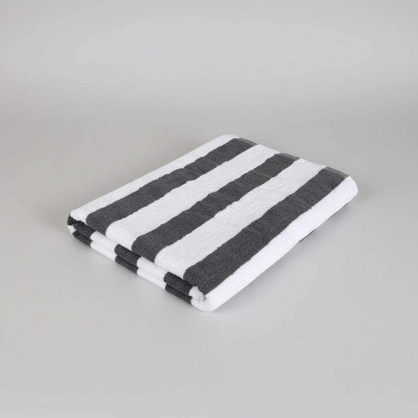 Black and white striped towel on a light-colored surface